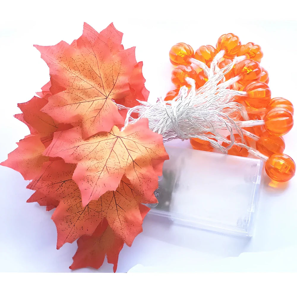 Halloween pumpkin light string with orange plastic pumpkins and warm white LED illumination