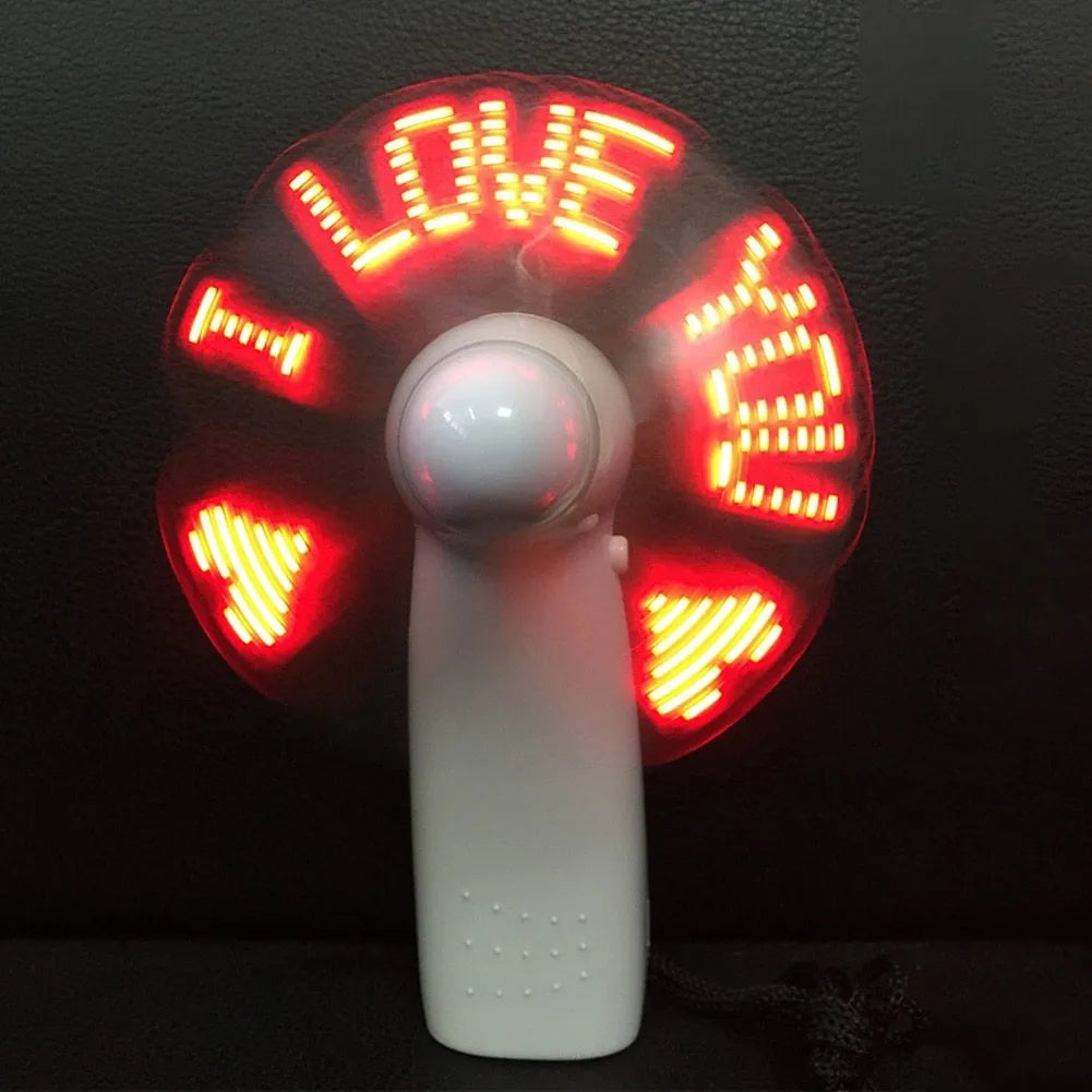 White handheld fan with LED love pattern display showing blue and red lights, measuring 10.8cm tall