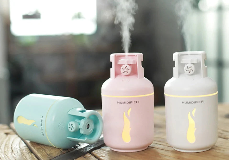 Compact USB-powered humidifier with 300ML water tank in pink, blue, or white