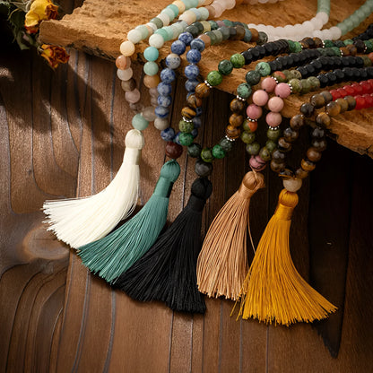Vintage bohemian-style long beaded sweater chain with a tassel, showing necklace and bracelet lengths.