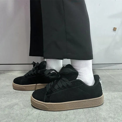 Black retro low-top sneakers with round toe, lace-up front, and a waterproof platform sole.