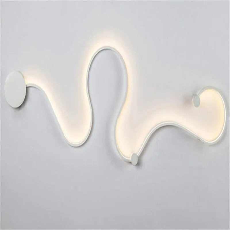 Modern black and white LED wall lamp with aluminium shade in four different sizes for bedside or corridor lighting
