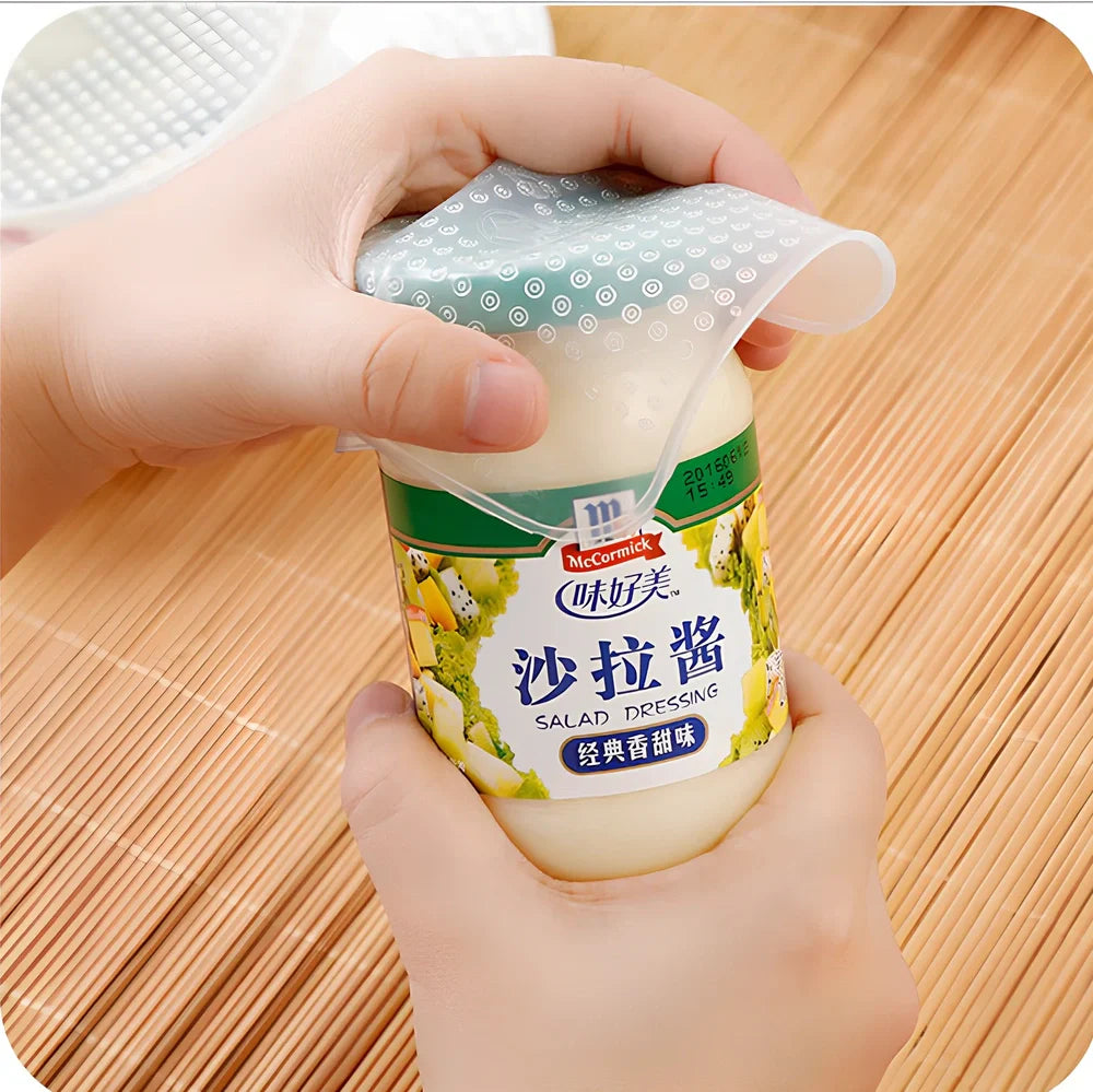 Reusable silicone stretch film covering bowl showing stretch capability and airtight seal