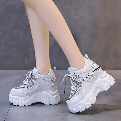 Women's white breathable mesh platform sports shoes with cross-strap detail and rubber sole