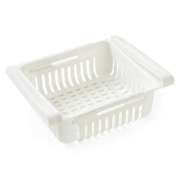 Plastic telescopic refrigerator storage basket in apricot colour, showing multiple compartments for organisation.