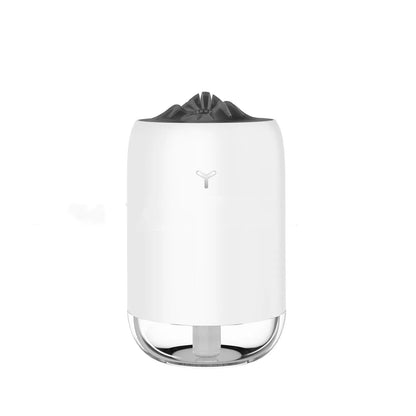 Compact cylindrical USB humidifier with night light in white, pink, or green, showing mist output.