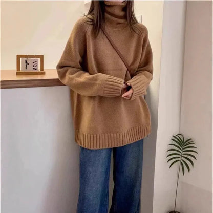 Women's turtleneck sweater in loose fit with thick curling pile collar, available in red, camel, grey, and black colours