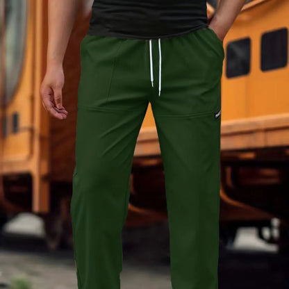 Men's polyester trousers for spring and autumn in light grey, shown in a casual setting