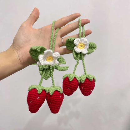 Handmade strawberry-shaped car pendant woven from cotton and hemp fibres, approximately 10-12cm long