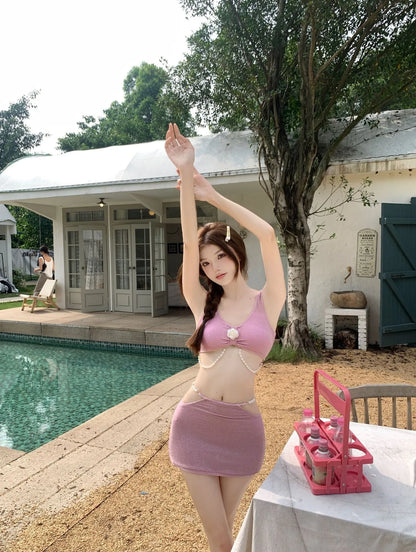 Pink and black three-piece bikini set with briefs style and sleeveless design for swimming.