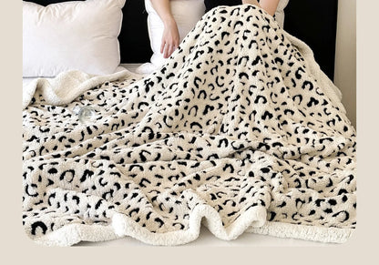 Double-layer cationic leopard jacquard taffeta blanket showing raised animal print pattern in available colour options