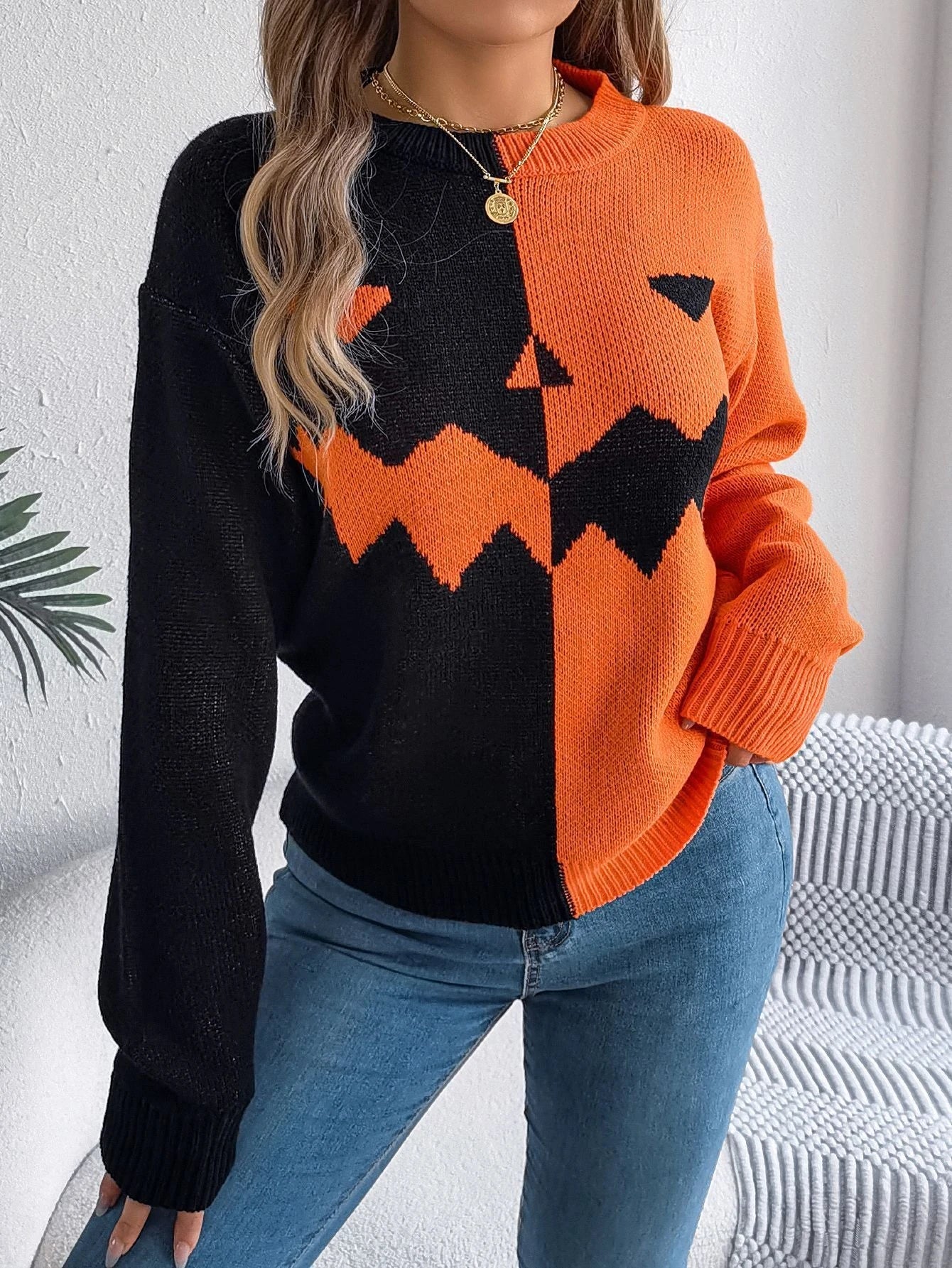 Cozy Halloween pullover sweater with ghost pattern in orange, khaki, and grey colors