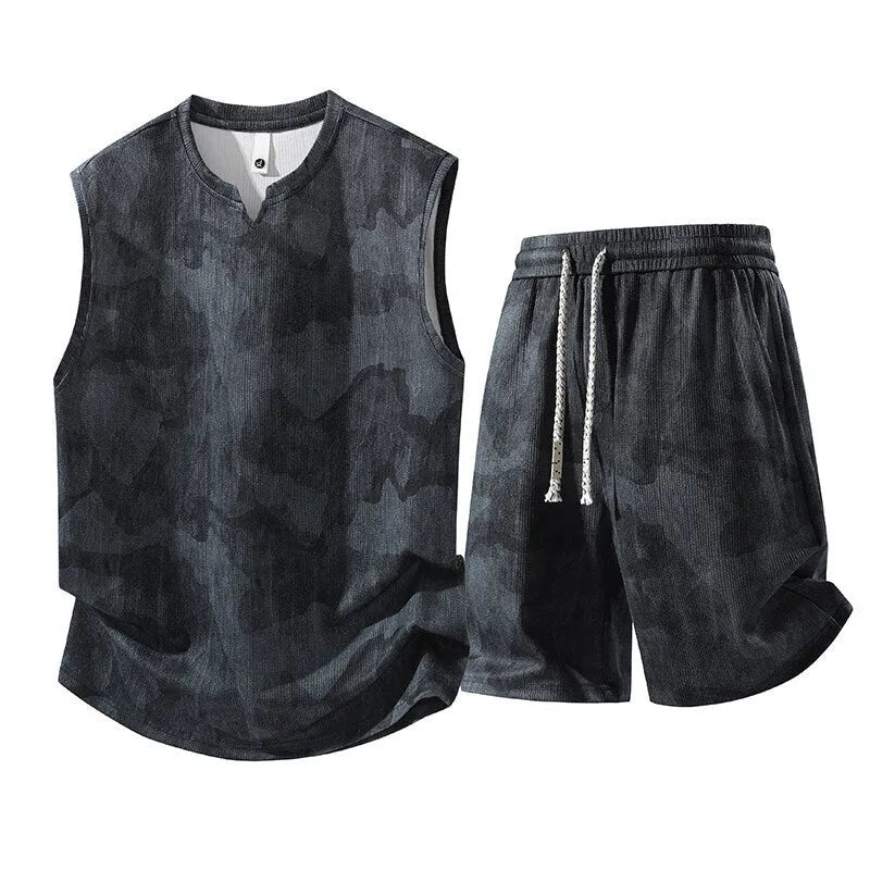 Man's casual sleeveless vest and shorts suit in a quick-drying fabric, shown in light denim blue.