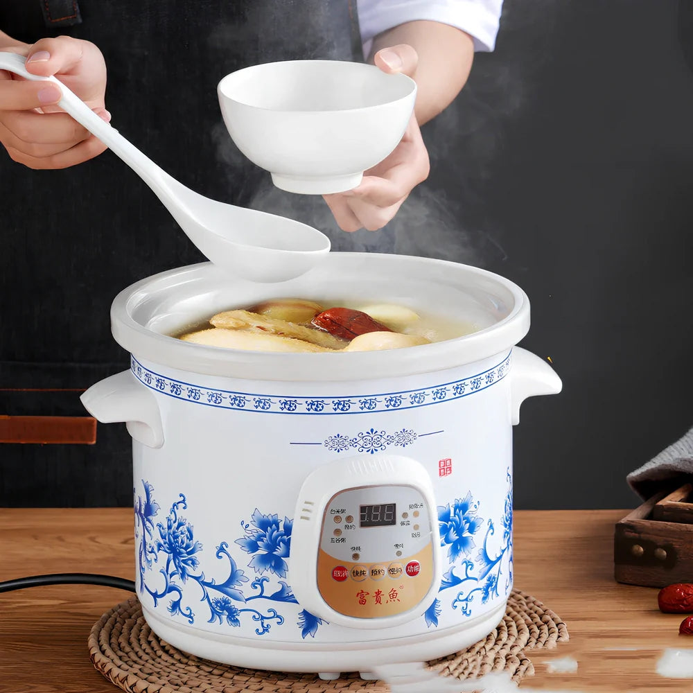 White porcelain electric stew pot with 22cm width and 1.5L capacity for automatic slow cooking