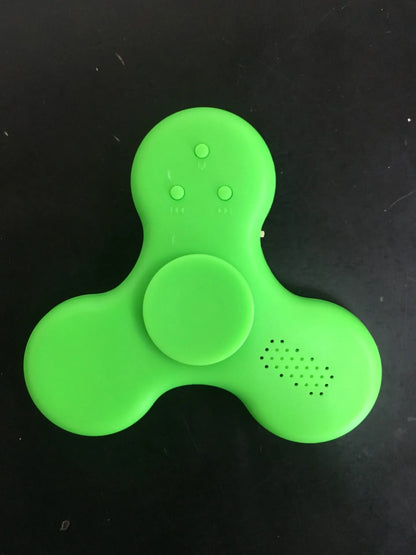 White Bluetooth speaker fidget spinner EDC toy with MP3 player functionality showing compact design
