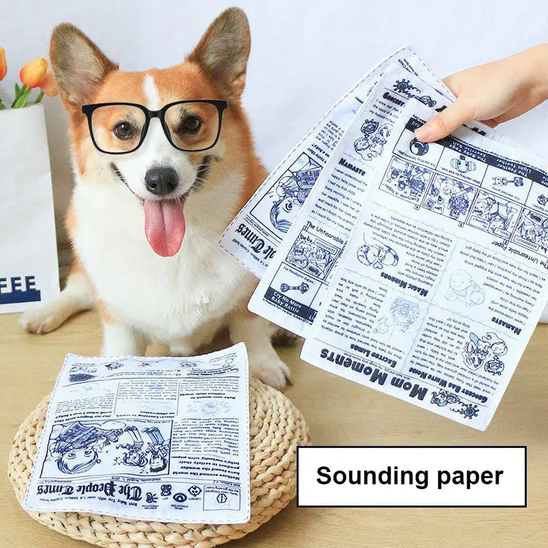 Tearproof squeaking dog toy with printed newspaper and playing card designs
