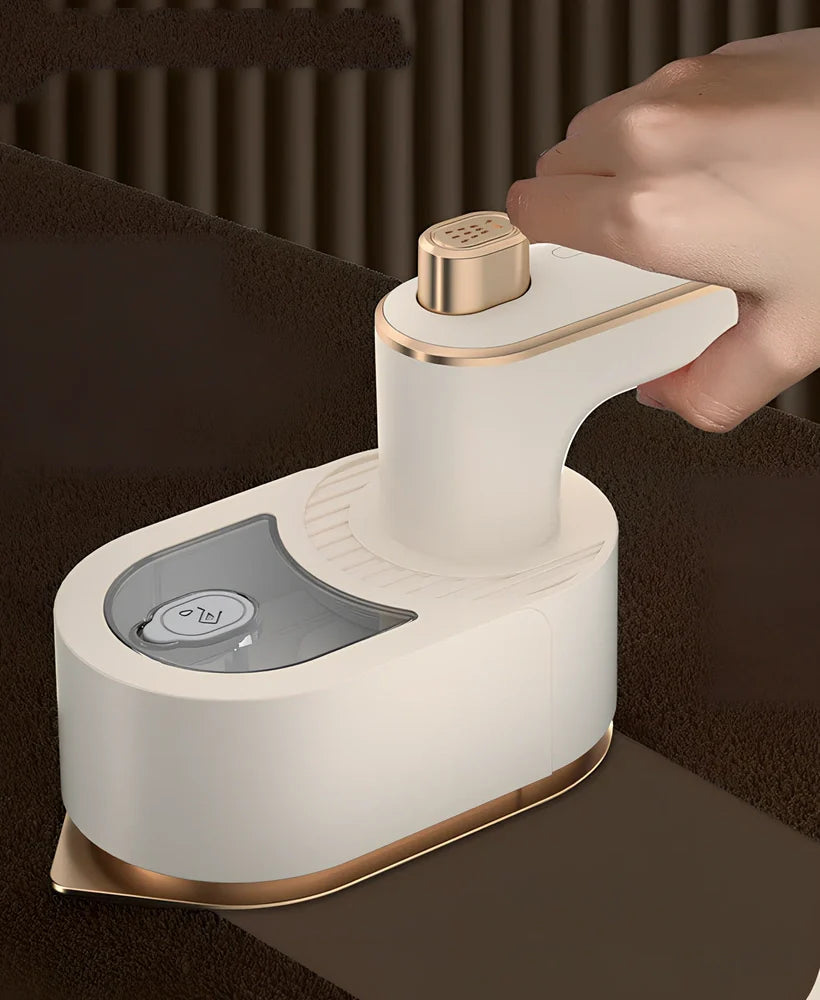 Green folding handheld garment steamer showing extended and collapsed positions with water tank visible