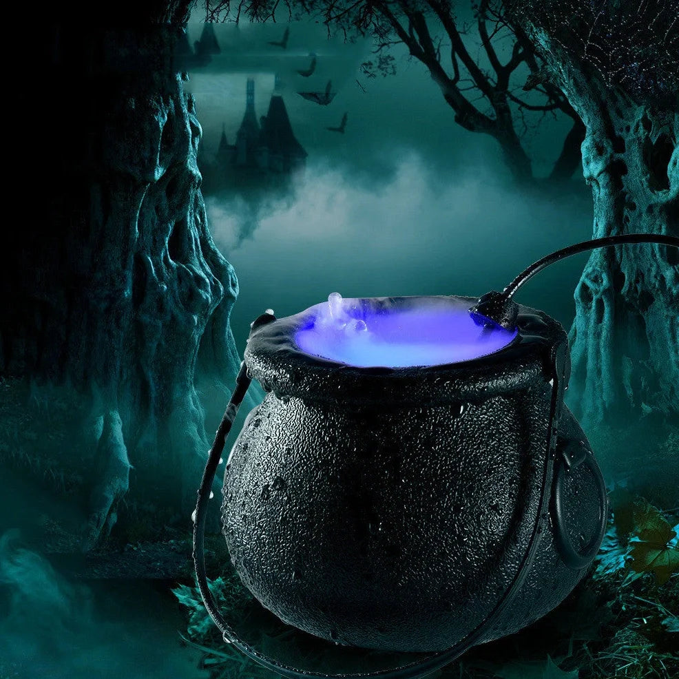 Halloween mist maker with colour-changing LEDs creating fog in water feature for indoor horror atmosphere