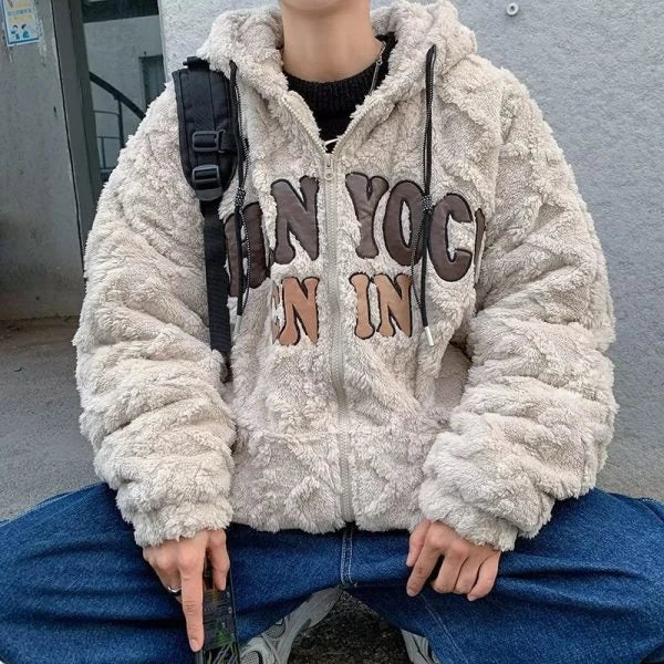 A cozy and stylish American retro-inspired lamb wool padded coat in apricot color, featuring a loose fit and long sleeves