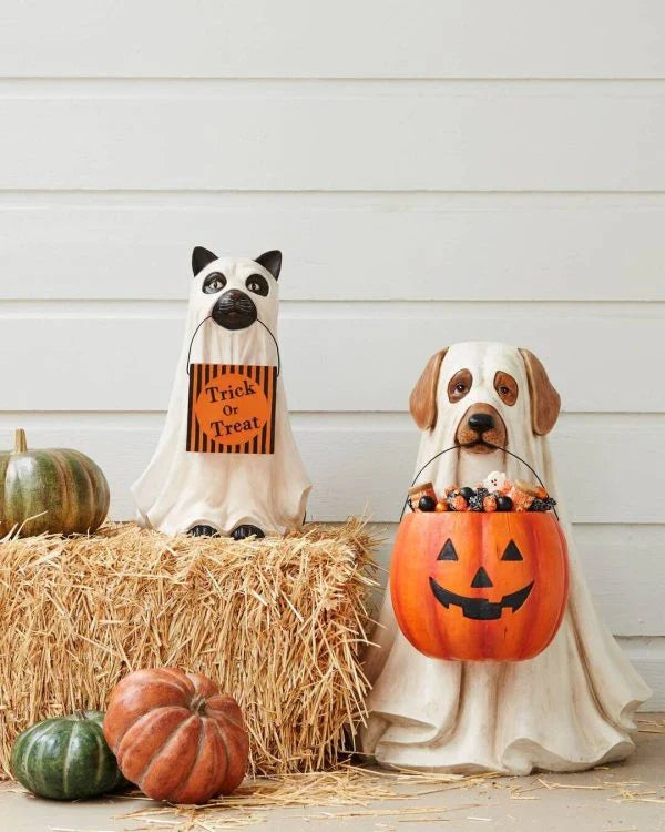 A ghostly dog figure carrying a large pumpkin candy bowl, an eerie and whimsical Halloween decoration for your home