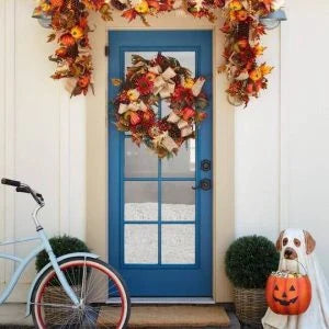 A ghostly dog figure carrying a large pumpkin candy bowl, an eerie and whimsical Halloween decoration for your home