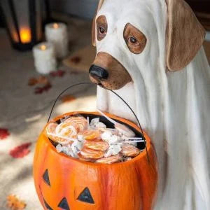 A ghostly dog figure carrying a large pumpkin candy bowl, an eerie and whimsical Halloween decoration for your home