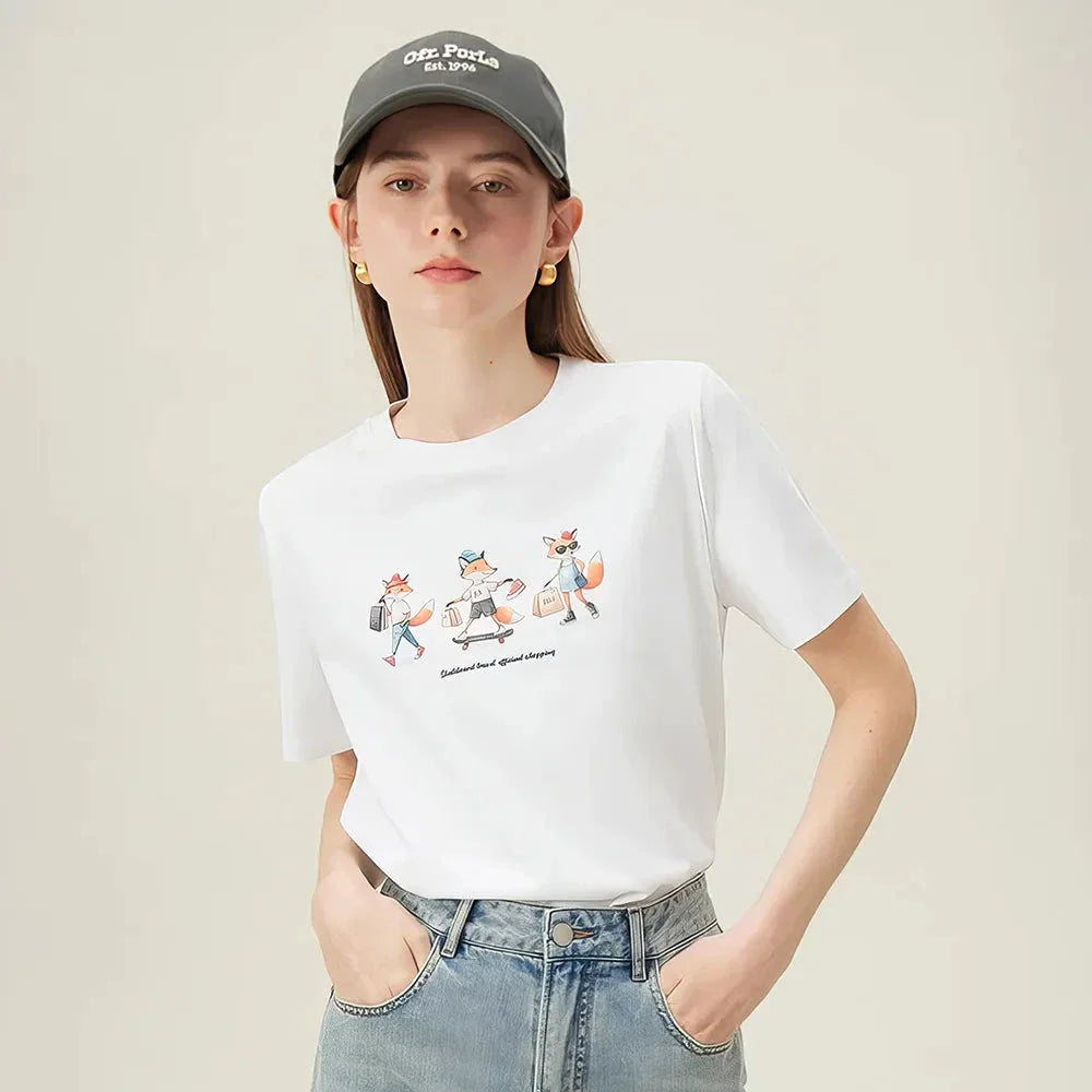 Women's white t-shirt with a playful cartoon fox print design, perfect for summer fashion.