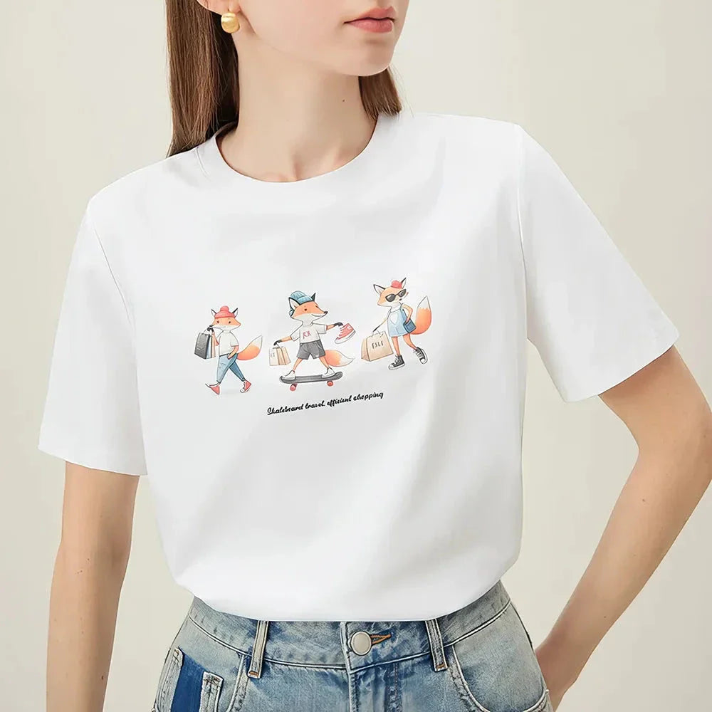 Women's white t-shirt with a playful cartoon fox print design, perfect for summer fashion.