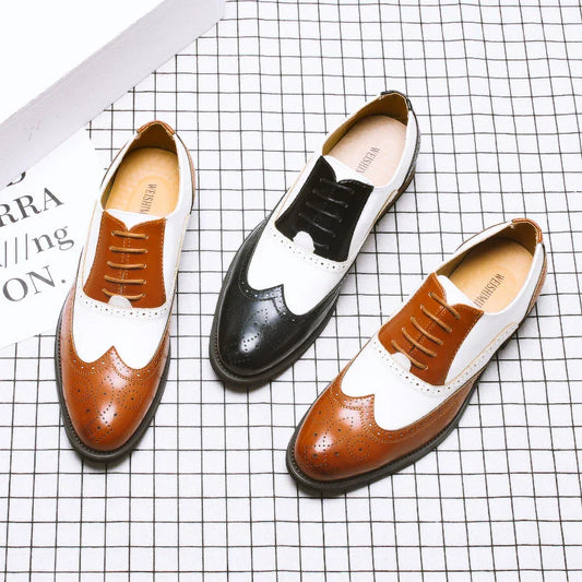 Elegant British-inspired men's business dress shoes with carved leather details and a sleek wedge heel