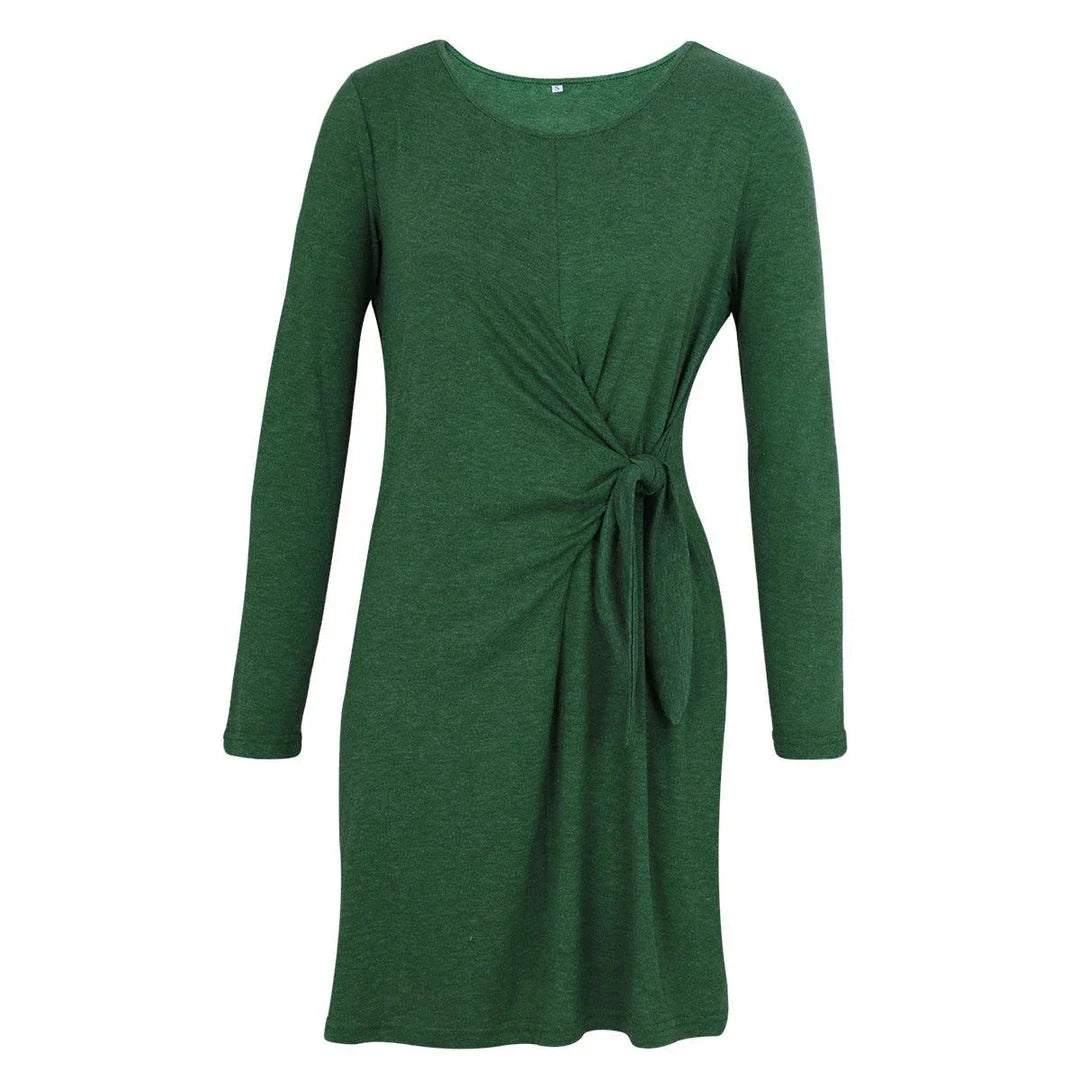 A green dress with long sleeves, featuring an A-line silhouette and a round neckline, perfect for autumn and winter seasons.