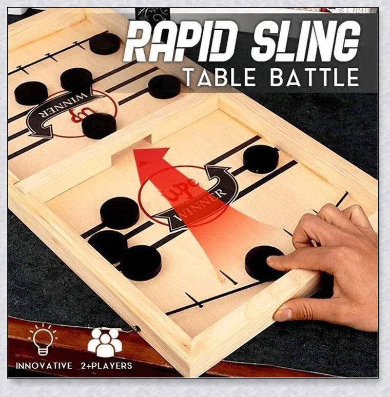 Two players competing in a wooden hockey game with pucks flying across the table