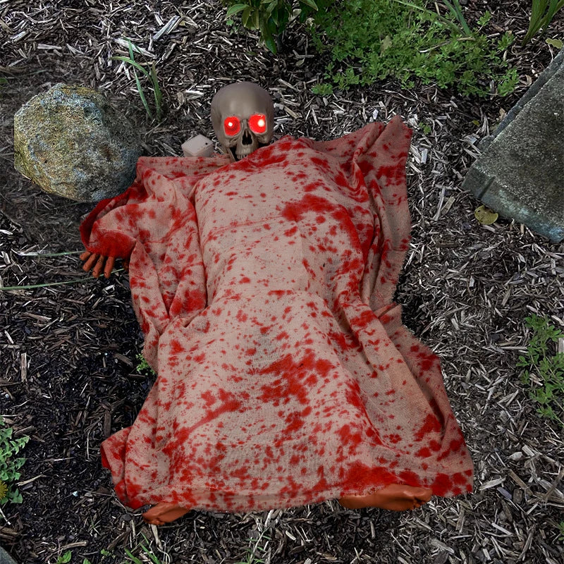 Haunting Halloween horror decor with voice-activated corpse, blood cloth, and glowing hair props
