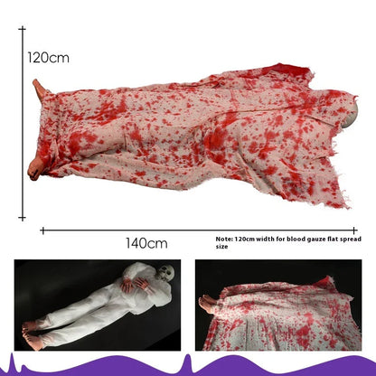 Haunting Halloween horror decor with voice-activated corpse, blood cloth, and glowing hair props