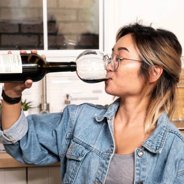 The Wine Glass Topper, a unique and elegant accessory that transforms any wine bottle into a personal wine glass, allowing for gentle aeration and enhanced flavor.