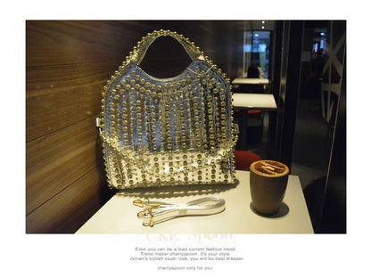 A glamorous messenger bag crafted with premium PU leather and adorned with sparkling diamond studs