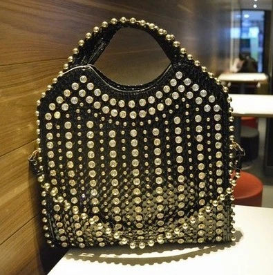 A glamorous messenger bag crafted with premium PU leather and adorned with sparkling diamond studs