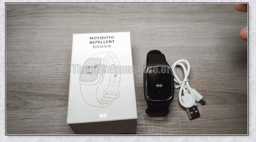 Ultrasonic mosquito repellent bracelet in black, white, and pink colors with a sleek, modern design