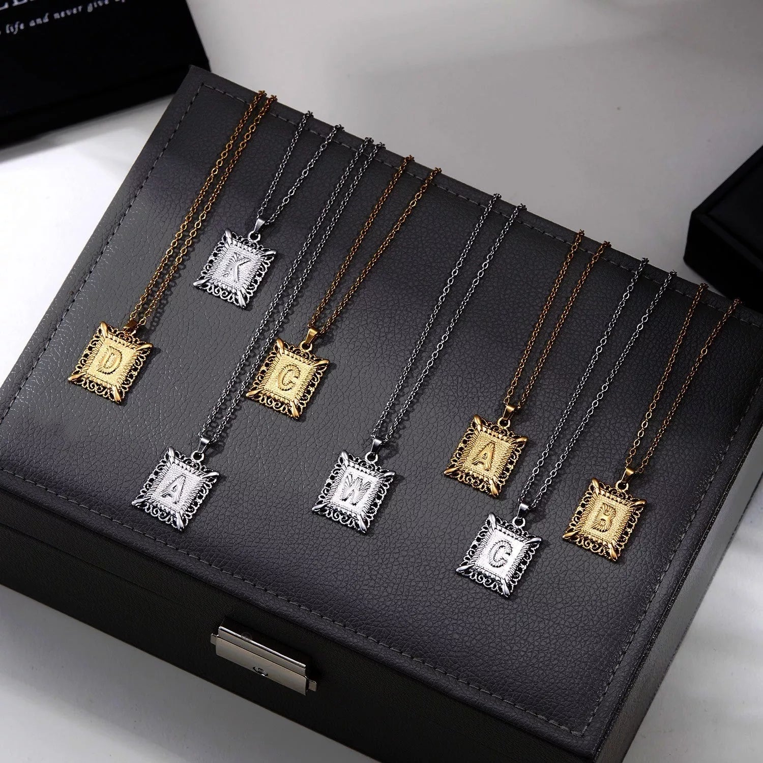 Personalized initial letter necklace in gold or steel, featuring any letter from A to Z