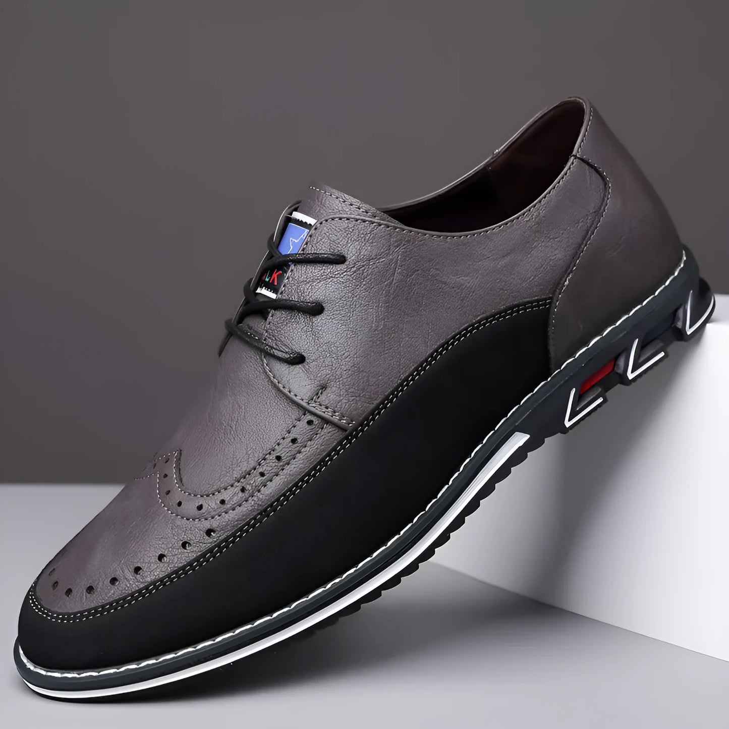 Men's black leather casual shoes with a leather toe cap and rubber sole on a white background.