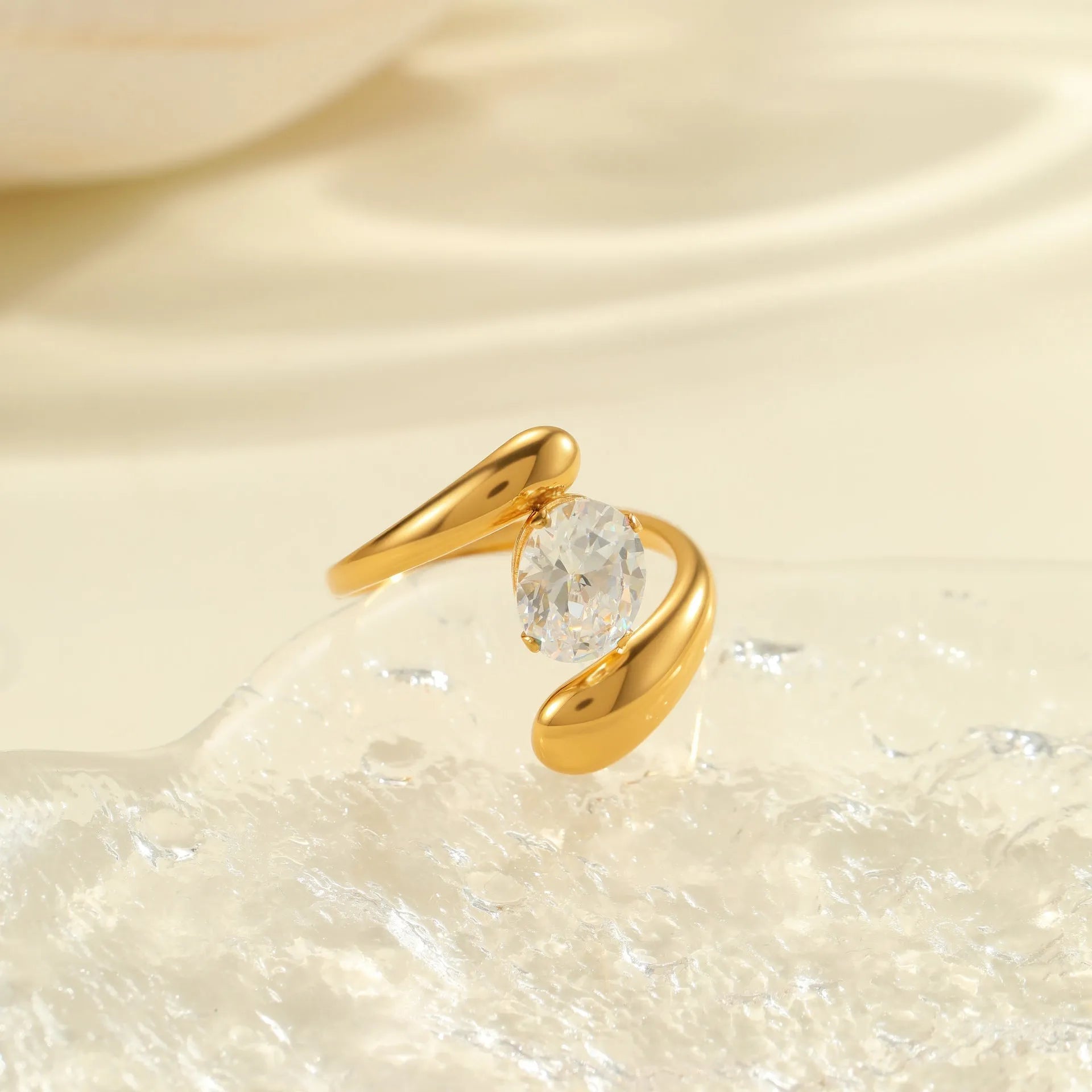 Geometric zircon ring showing round, oval and quadrangular design elements in stainless steel with electroplated finish