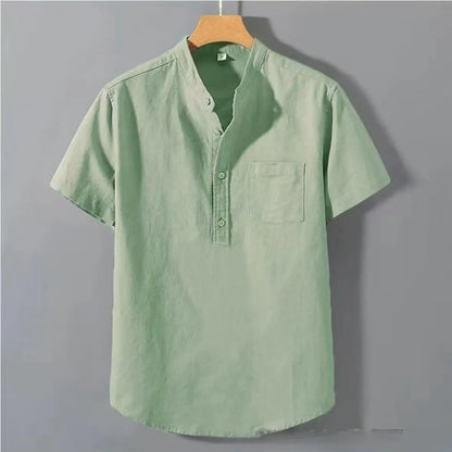 Man wearing a beige loose-fit linen blend casual shirt with a stand collar and short sleeves.