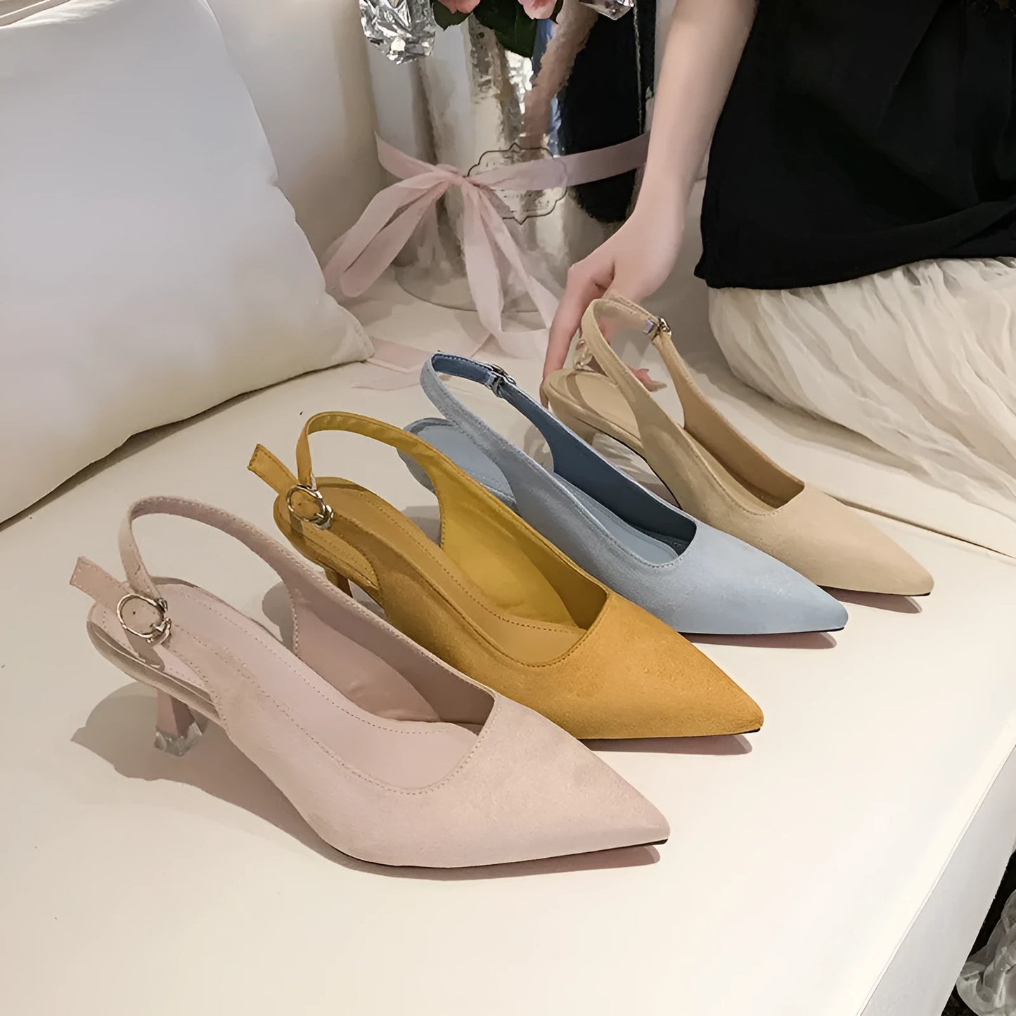 Apricot suede women's pointed-toe stiletto high heels on a plain background.