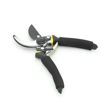 Yellow and green garden shears with 50# steel blades cutting 30mm branches