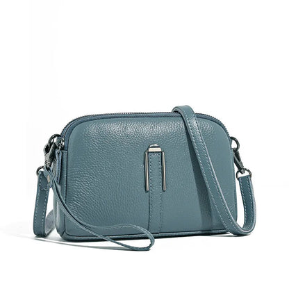 Minimalist top-grain leather crossbody bag in horizontal square shape with inner pockets, available in five colours