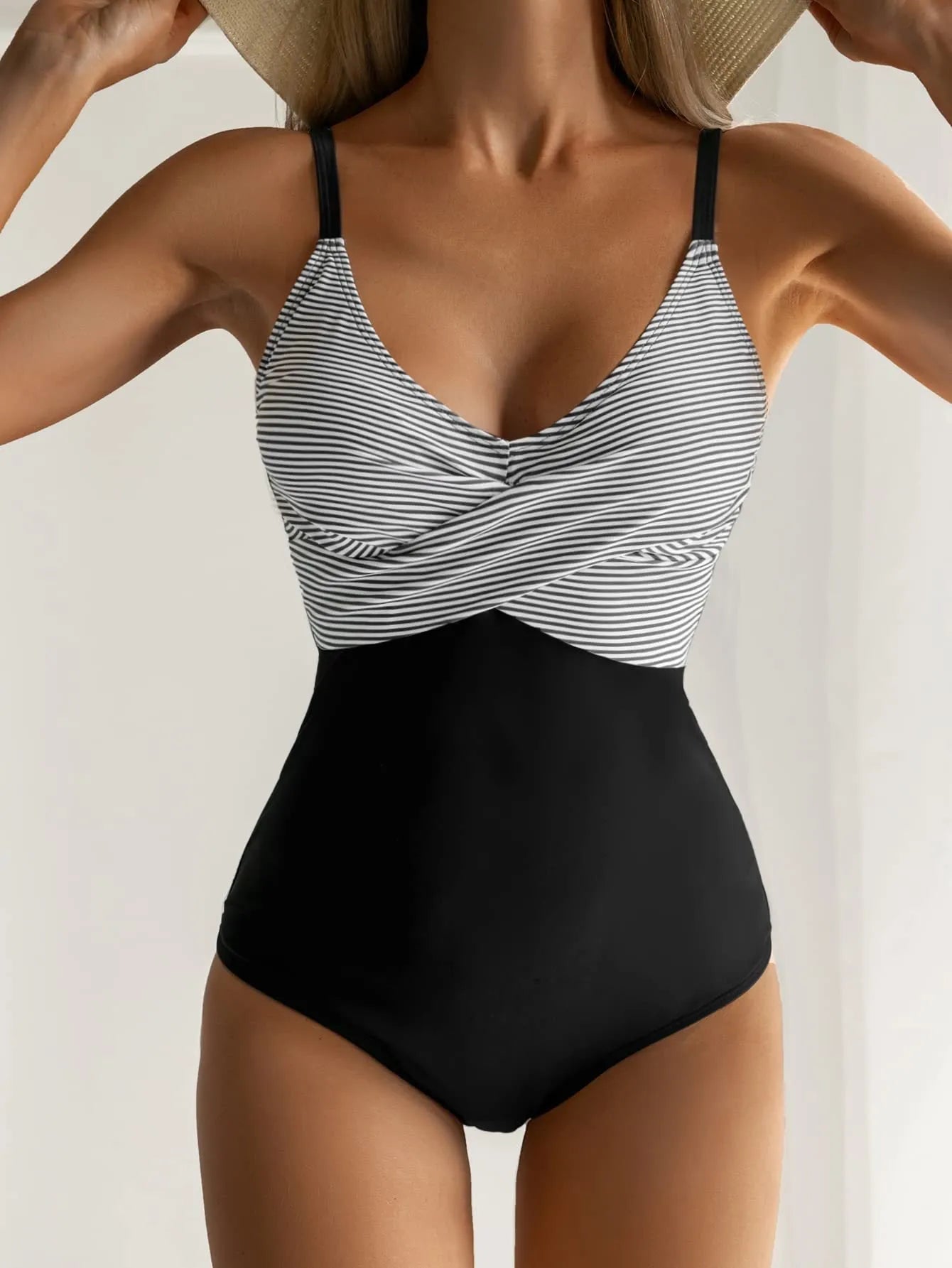 Women's backless swimsuit with lace-up detail in leopard print pattern, showing adjustable back design