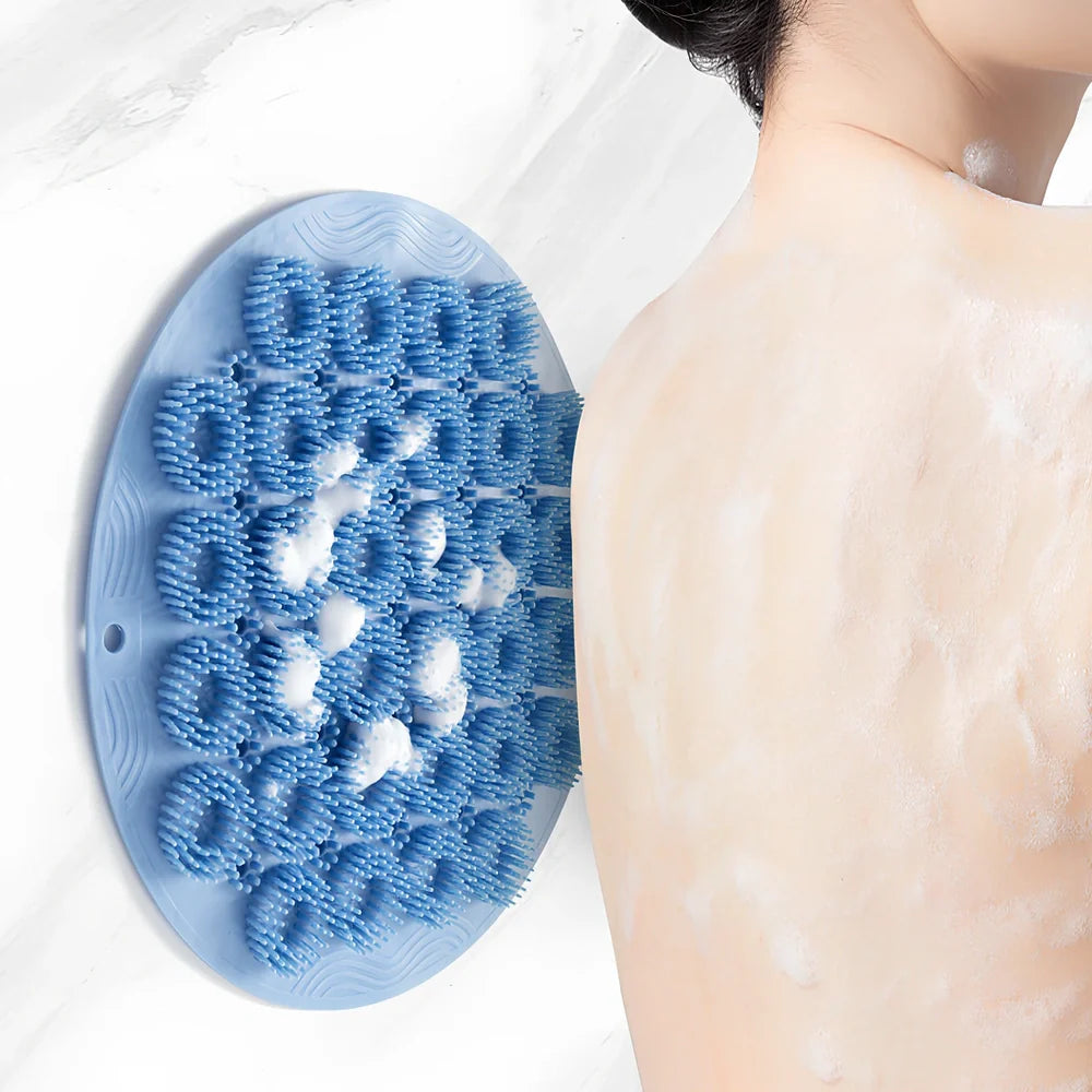 Sky blue silicone back bath brush with suction cups measuring 30x30cm