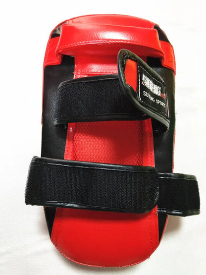 Black with red edges hand-held martial arts target showing 35cm by 19cm striking surface and double adhesive buckle