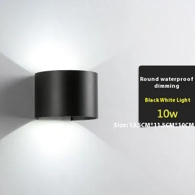 Black LED wall lamp with aluminium body and glass shade mounted on wall