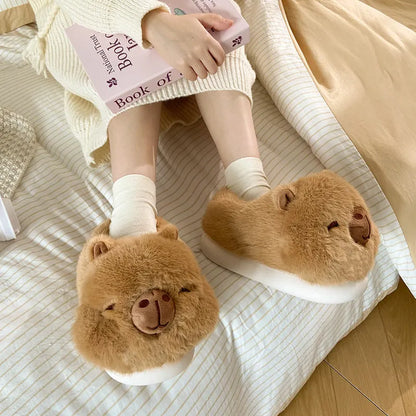 Light brown women's winter slippers with cartoon pattern, plush upper, and thick PVC sole