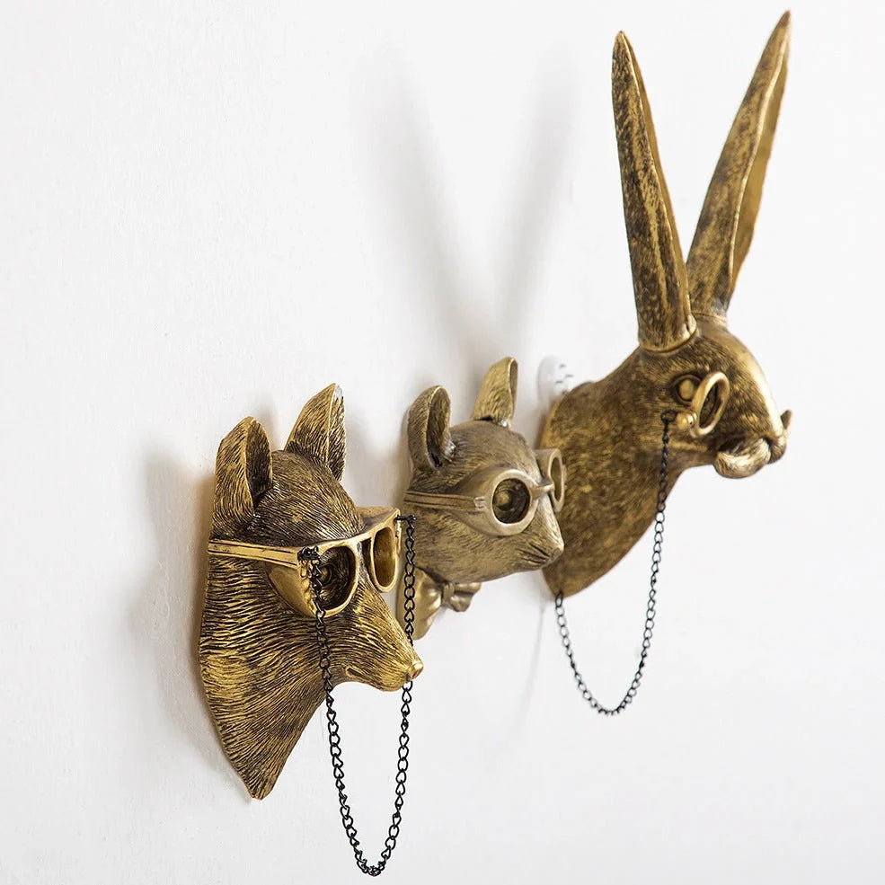 Antique bronze animal pendant showing bear design with synthetic resin construction